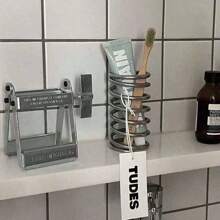 1 pièce Porte-brosse à dents en acier inoxydable, Porte-brosse à dents avec égouttoir, Support de conception à ressort créative, Organisateur de décoration minimaliste, Porte-pinceau de maquillage, Organisateur d'ustensiles de cuisine, Boîte de rangement multifonction pour la maison