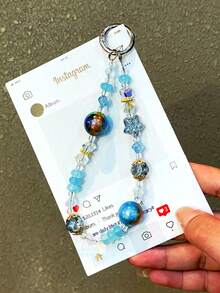 1 件全新时尚银河猫眼珠和星形水晶挂链，防丢失钥匙扣装饰，精致高端手机壳吊饰，男女通用手链