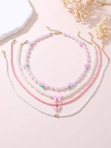 Set de 4 collares con cuentas de perlas con diseños de corazones y fresas para niñas