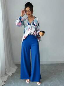 Conjunto de pantalones de pierna ancha: Top de manga larga con estampado azul y pantalones de pierna ancha