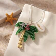1 pieza Collar de mujer con colgante versátil de estilo clásico con cuentas de cristal de temática oceánica, tela no tejida con árbol de palma, estrella de mar y concha, adecuado para fiestas en la playa, vacaciones y uso diario casual (posición aleatoria de los cristales, cantidad y color aleatorios de perlas en la parte inferior)