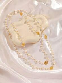 1 pièce Collier long de perles pour femmes, chaîne polyvalente multi-couches pour pull, avec un motif floral creux de Camélia, accessoire élégant de mode pour soirée