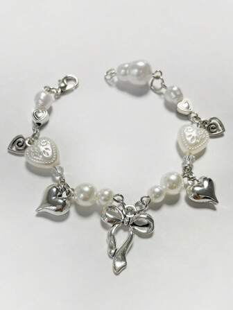 1 st. moderiktigt minimalistiskt avslappnat rosett- och hjärtformat ihåligt roterande akrylpärlarmband, lämpligt för kvinnor vardags- eller festkläder