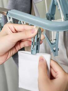 Tendedero plegable resistente al viento de plástico para ropa, calcetines y toallas