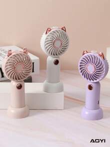 AOYI 1 Mini ventilador de mano recargable con diseño de dibujos animados, 3 velocidades ajustables, con cable de carga USB y base - Multicolor - Ver 4