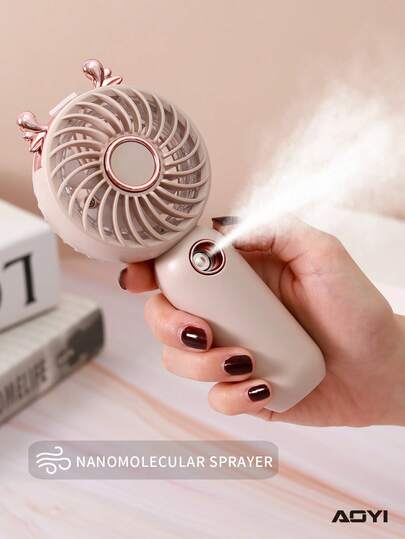 AOYI 1 Mini ventilador de mano recargable con diseño de dibujos animados, 3 velocidades ajustables, con cable de carga USB y base