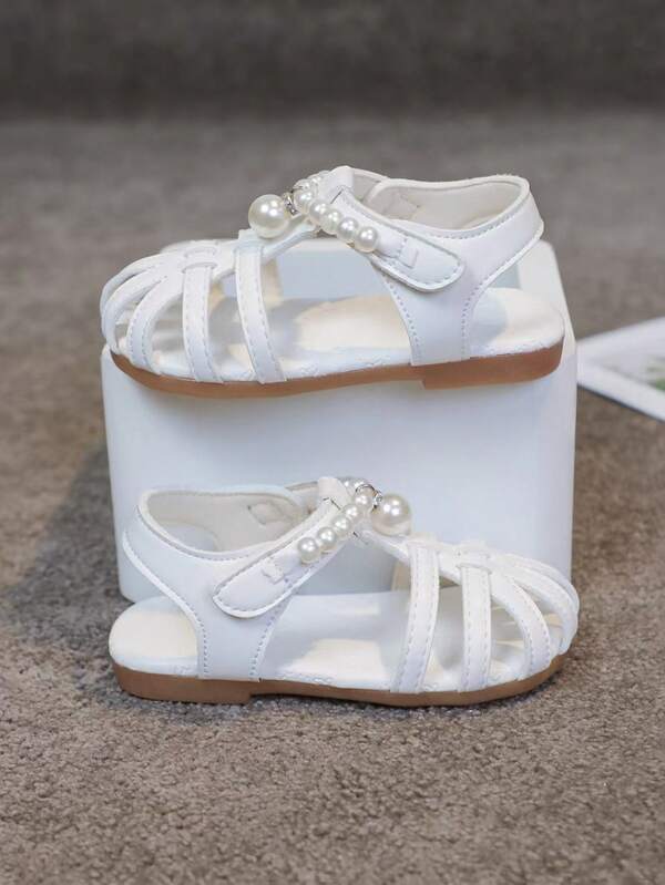 New Baby Sandals. Infant Sandals. The Highlights Of These Baby Sandals Are: Appearance Design - Faux Pearl Decoration: Decorating The Shoelaces With Faux Pearls, Elegant And Exquisite, Adding A Sweet And Lovely Atmosphere, Which Is In Line With The Innocent And Lovely Nature Of Children, And Also Meets The Current Popular Aesthetics, Which Can Meet The Parents' Needs For Fashionable Dressing Of Their Babies. - Criss-Cross Straps: The Innovative And Unique Criss-Cross Strap Design Not Only Increases The Beauty Of The Sandals, But Also Visually Modifies The Contour Of The Baby's Feet, Making The Feet Look Smaller And Cuter.