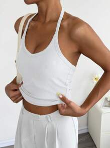 Top sin espalda de punto con cuello halter en color blanco para looks chic de verano