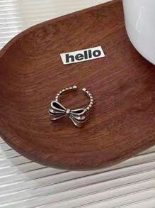1 pieza Anillo con flor hueca y lazo, adecuado para uso diario para mujeres