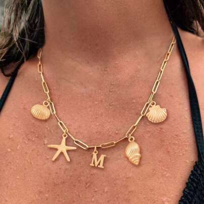 1 pieza Collar con colgante de acero inoxidable dorado con cadena de clip de papel, con diseño de estrella de mar y concha clásica y de moda para mujer, joyería de playa de verano