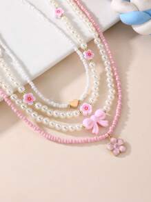 Set de 4 collares con mariposas y flores de perlas y cuentas para niñas