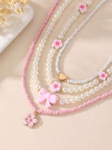 Set de 4 collares con mariposas y flores de perlas y cuentas para niñas