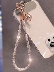 Brazalete tipo cadena de lujo con colgante de lazo y corazón con diamantes de imitación para teléfono móvil