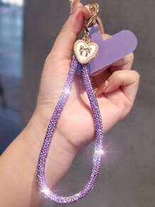 Brazalete tipo cadena de lujo con colgante de lazo y corazón con diamantes de imitación para teléfono móvil