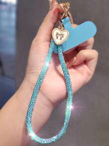 Brazalete tipo cadena de lujo con colgante de lazo y corazón con diamantes de imitación para teléfono móvil