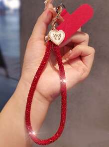 Brazalete tipo cadena de lujo con colgante de lazo y corazón con diamantes de imitación para teléfono móvil