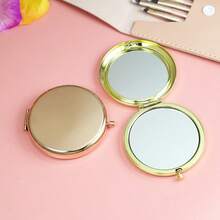 1个圆形双面便携化妆镜，男女通用，可折叠金属材质，口袋大小，方便携带，360度旋转，可爱迷你手持镜，是大学生、旅行者和化妆师的理想之选，也是情人节礼物和圣诞节礼物的绝佳选择。适用于化妆、家居装饰、梳妆台、旅行、卧室等场合，是化妆配件的理想之选。 - 金色 - 查看 10