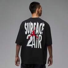 Nike Camiseta deportiva hombre con estampado de figura y cuello caído - Negro - Ver 2