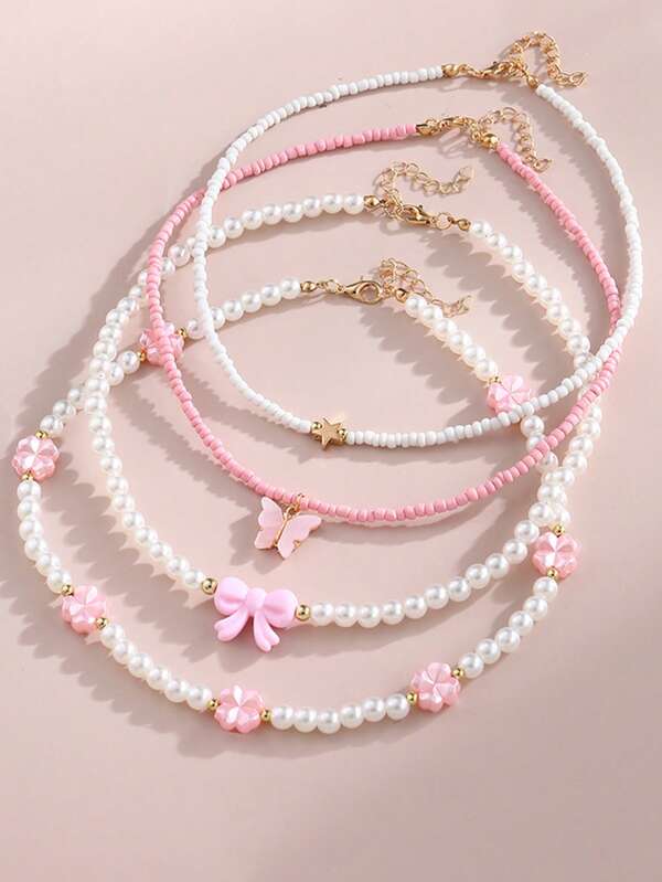 4 pièces Collier perles style bohème avec pendentifs papillon, nœud, cœur et fleur