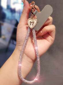 Brazalete tipo cadena de lujo con colgante de lazo y corazón con diamantes de imitación para teléfono móvil