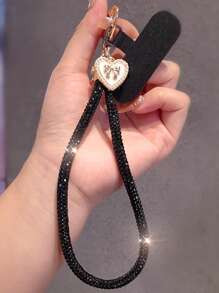 Brazalete tipo cadena de lujo con colgante de lazo y corazón con diamantes de imitación para teléfono móvil