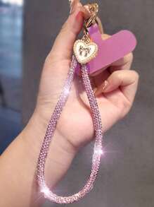 Brazalete tipo cadena de lujo con colgante de lazo y corazón con diamantes de imitación para teléfono móvil