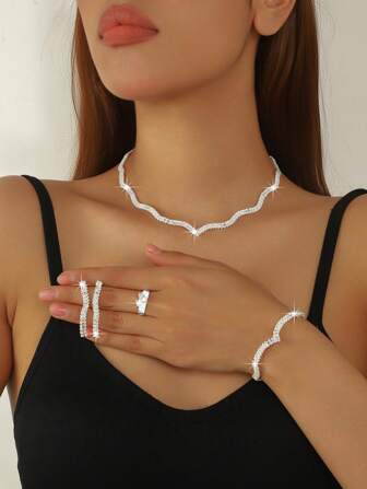 A Set Of Four Elegant Silver-Plated Diamond Jewelry Pieces