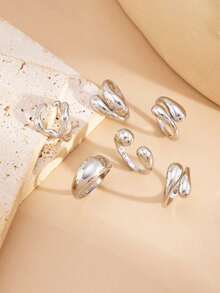 6pcs/Set Vintage Minimalist Alloy Molten Lava Teardrop Design Open Rings, Asymmetrical Fashionable Thick Metal Gold Tone Ring Set, Irregular Drops Of Liquid Metal Drape Over The Ring, Its Surface Replicating The Etched Texture Of Waves, With A Cold Sea Spray Luster On The Electroplated Silver Background. The Glazed Droplets Are Embedded With A Bubble Pattern, A Blue And White Gradient That Resembles The Crashing Waves Of The , And A Crescent-Shaped Indentation Hidden In The Ring's Opening And Closing Points. When The Fingertip Shakes, The Cut Surface Reflects The Shimmering Waves, As If Wearing The Instantly Frozen Waves On The Finger, The Gentle And Rigid Design Allows A Sense Of Niche And A Sense Of Art To Coexist.Suitable For Women's Daily Commute,Perfect Gift For Birthdays, Holiday Gifts, And Parties. Suitable For Daily Wear And Holiday Celebrations, Suitable For All Seasons, And Is An Ideal Choice For Holiday Accessories. - 銀色 - 查看 4