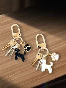 1个狗狗爪印珐琅钥匙扣，可爱的锌合金宠物吊坠，饰有黑色和金色狗狗剪影，非常适合挂钥匙、包包和汽车配件。包包吊坠，俏皮的爪印，闪亮的表面，小狗配饰，是爱狗人士的理想礼物，也是送给朋友的礼物