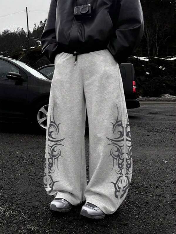 Lässige Jogginghose mit Totempfahl-Muster vorne und hinten, Straight-Leg Loose Fit im Streetstyle, englisches Graffiti-Grafik, bequeme Streetwear