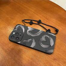Set de 2 fundas: teléfono + pulsera negra con cordón de TPU anticaídas. Funda con estampado de corazón en tinta gris. Compatible con S22/223/S24/S25 Ultra/S25 Edge, 16/15/14/13/12 Pro y 16 Plus. - Negro - Ver 5