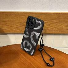 Set de 2 fundas: teléfono + pulsera negra con cordón de TPU anticaídas. Funda con estampado de corazón en tinta gris. Compatible con S22/223/S24/S25 Ultra/S25 Edge, 16/15/14/13/12 Pro y 16 Plus. - Negro - Ver 3