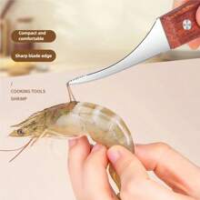 1件不锈钢虾壳去壳工具 - 易于清洁的海鲜处理工具，可有效去除虾壳和内脏，是家庭烹饪和露营的必备工具。
