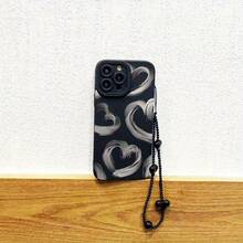 Set de 2 fundas: teléfono + pulsera negra con cordón de TPU anticaídas. Funda con estampado de corazón en tinta gris. Compatible con S22/223/S24/S25 Ultra/S25 Edge, 16/15/14/13/12 Pro y 16 Plus. - Negro - Ver 2