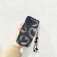 Set de 2 fundas: teléfono + pulsera negra con cordón de TPU anticaídas. Funda con estampado de corazón en tinta gris. Compatible con S22/223/S24/S25 Ultra/S25 Edge, 16/15/14/13/12 Pro y 16 Plus. - Negro - Ver 1
