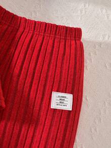 Conjunto de top acanalado de manga farol bordado y pantalones para niñas