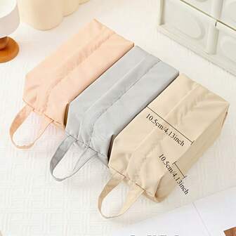 A Set Of Three Fabric Storage Bags, Portable Travel Makeup Pouch, Storage Bags For Underwear And Socks, Hand Wash, Available In Gray, Pink, And Light Brown, Perfect For Travel.