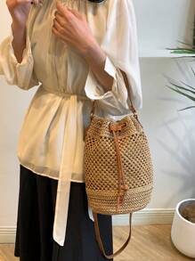 Bolso de playa tipo cubo de estilo boho con cordón, bolso de mano tejido de paja, diseño de nicho de moda, bolso de cubo cruzado versátil para la playa, nuevo modelo 2025