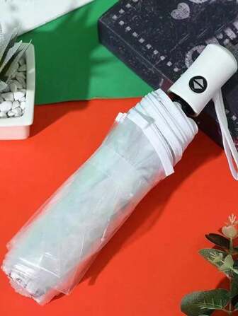 1 pièce Parapluie de voyage portable entièrement automatique et pare-vent, léger et durable en plastique transparent, design à triple pliage, convient pour l'extérieur, la plage, le style casual/mode, compact et pratique, protection contre le vent, protection météorologique portable, design transparent