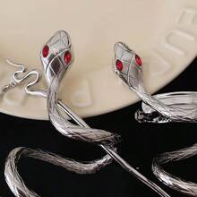 An Elegant Retro And Unique Silver Snake-Shaped Hairpin, Silver Winding Design - Red Pupil Chain Pendant. Chic And Simple Campus Style - Ideal Photo Props - Metal Deformation Punk Hair Clip Headdress L Retro Gothic Hair Chain L Women's Hair Rope. Unique Tassel Hair Clip - Multi-Scene Accessories - Daily Wear, Gifts, And Special Occasions, Bun Extension, Hair Bun Maker, Bun Hair Piece, Hair Styling Pins, Pins For Hair, Claw Clips, Bobby Pins