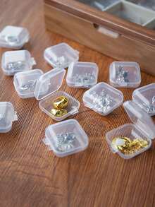 1个多功能透明塑料收纳盒，配有10/15/24/28个固定隔层、36个可调节隔层和28/56个可拆卸隔层，适合收纳耳环、戒指、珠宝和美甲配件，是返校季必备品。 - 彩色 - 查看 9