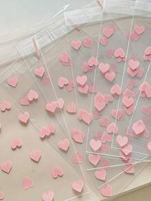 100 个/50 个带有心形图案的自粘塑料袋，耐污，一次性，多用途礼品包装材料 - 非常适合礼物和生日礼物！ - 無色 - 查看 3
