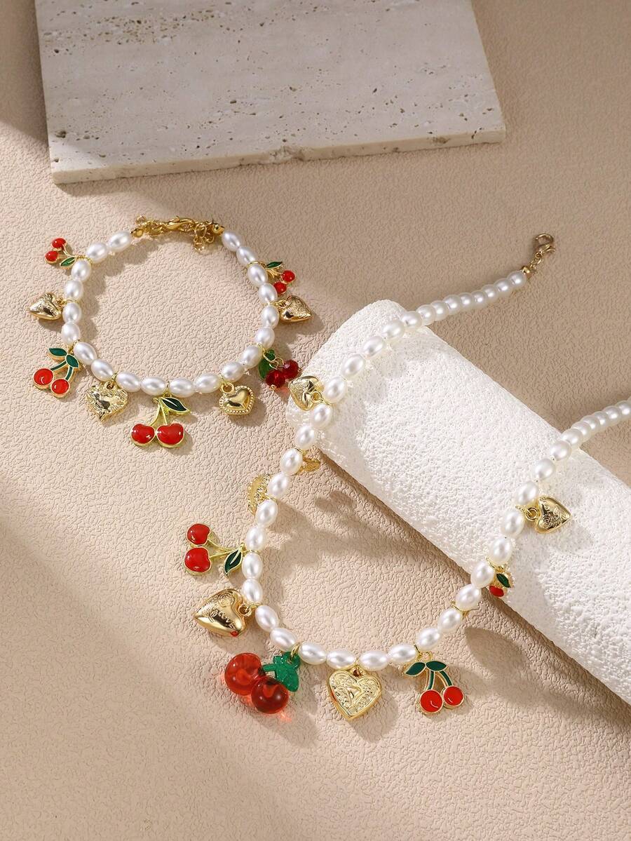 Set de joyas de 1/2 piezas de collar y pulsera con cuentas de perlas falsas con adornos de lazo, corazón, flores de cerámica y cereza para niñas