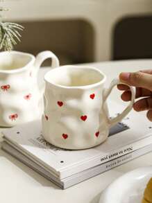 1pc INS Style Large Capacity Ceramic Mug With Bowknot & Heart Design, Handcrafted Asymmetrical Coffee Cup, Suitable For Home Breakfast, Milk, Oatmeal, Garden Afternoon Tea, Latte Art, Juice & Couple Water Cup
