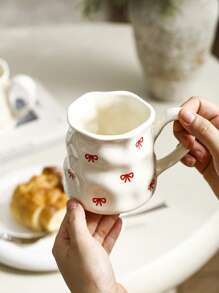 1pc INS Style Large Capacity Ceramic Mug With Bowknot & Heart Design, Handcrafted Asymmetrical Coffee Cup, Suitable For Home Breakfast, Milk, Oatmeal, Garden Afternoon Tea, Latte Art, Juice & Couple Water Cup