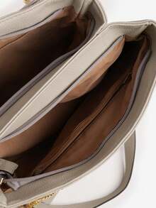 绗缝双隔层包，配有手柄和可调节肩带，附赠一个口袋