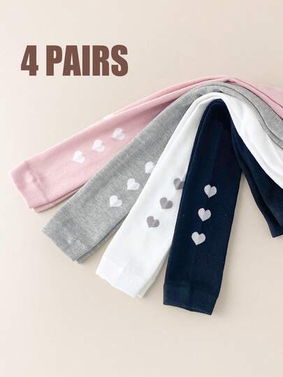 4条女童七分紧身裤，儿童打底裤，纯色简约爱心图案修身裤，厚度适中，适合搭配裙子穿着。