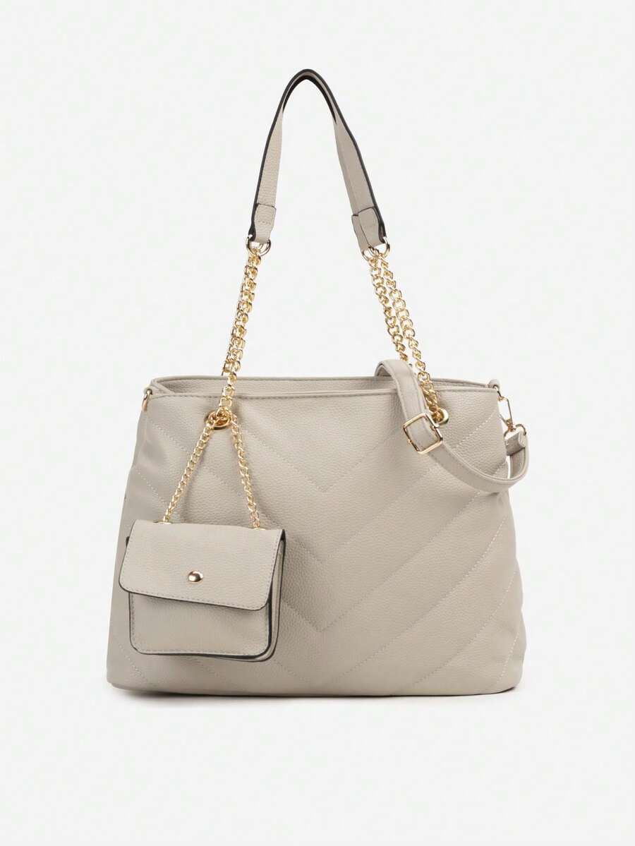 绗缝双隔层包，配有手柄和可调节肩带，附赠一个口袋