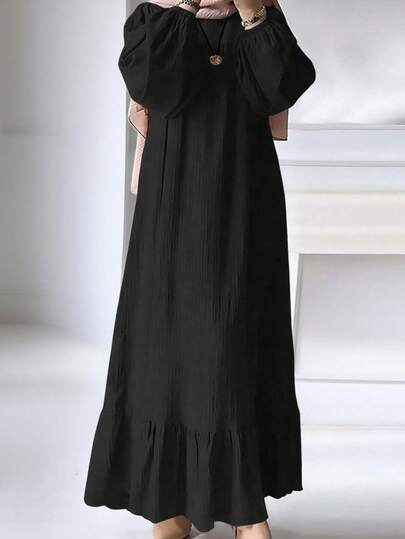 Vestido elegante de mujer de unicolor con mangas abullonadas y volantes en el bajo, estilo árabe, primavera negro