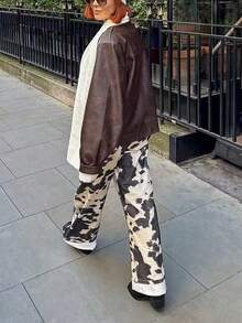 休闲复古牛皮印花裤